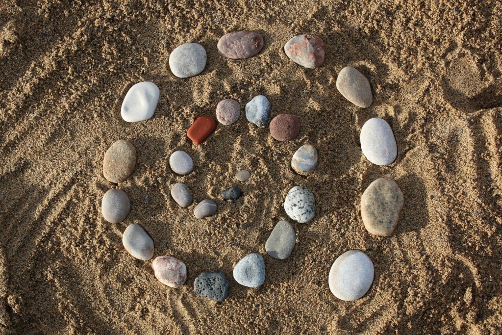Stones in a circle in the sand symbolizing the Akashic Records